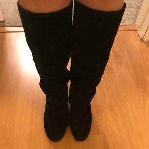 Black boots with wrapped wedge heels